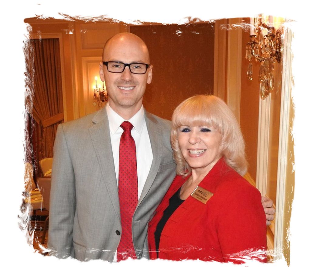 A man and woman standing next to each other.